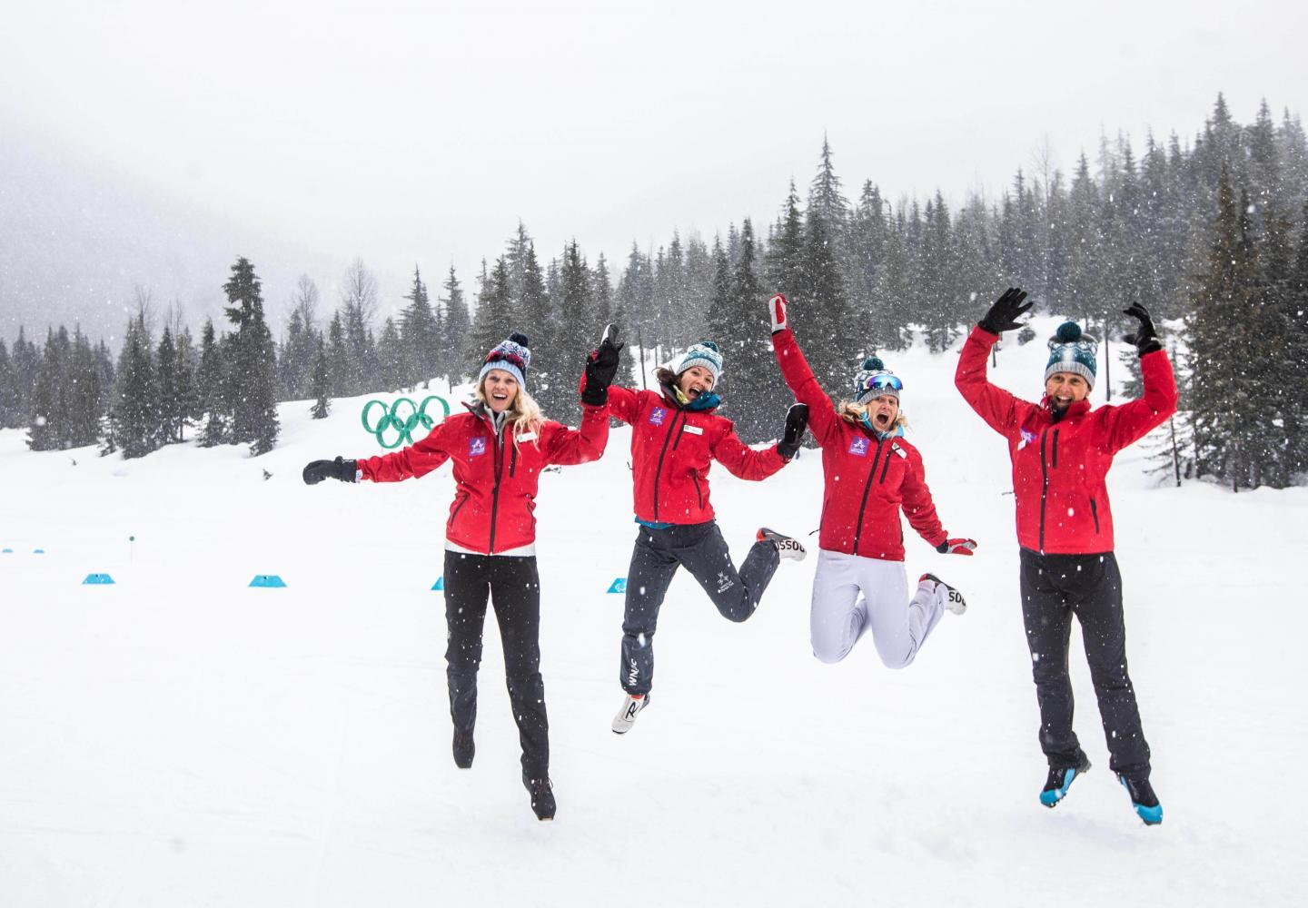 Group of people jumping on snow