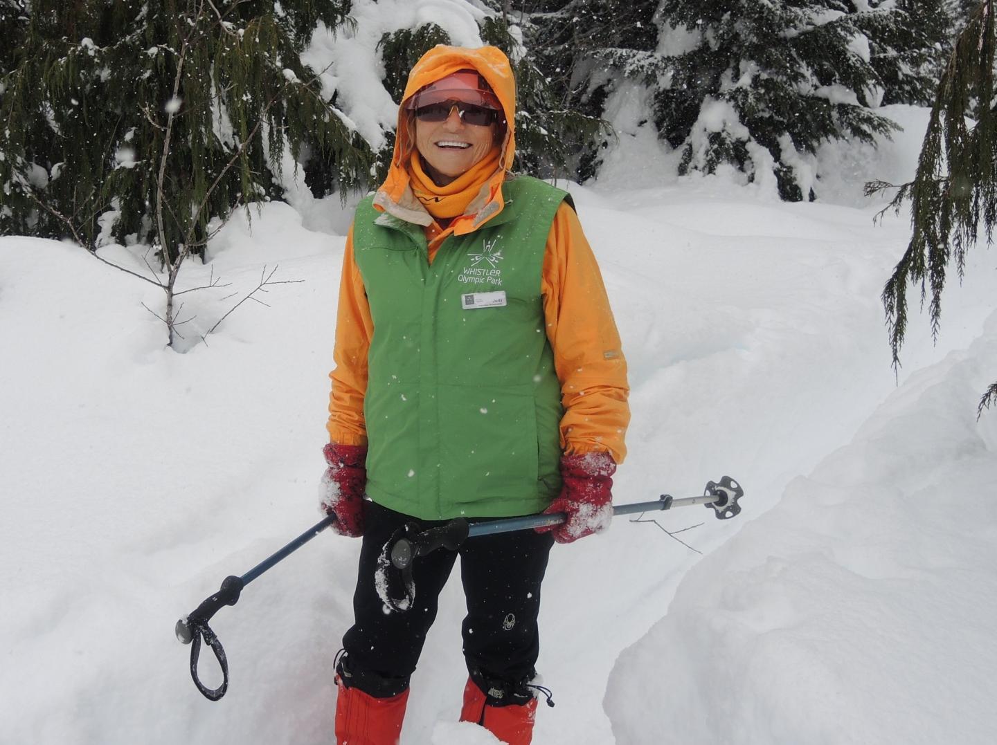 volunteer ski instructor standing in the snow