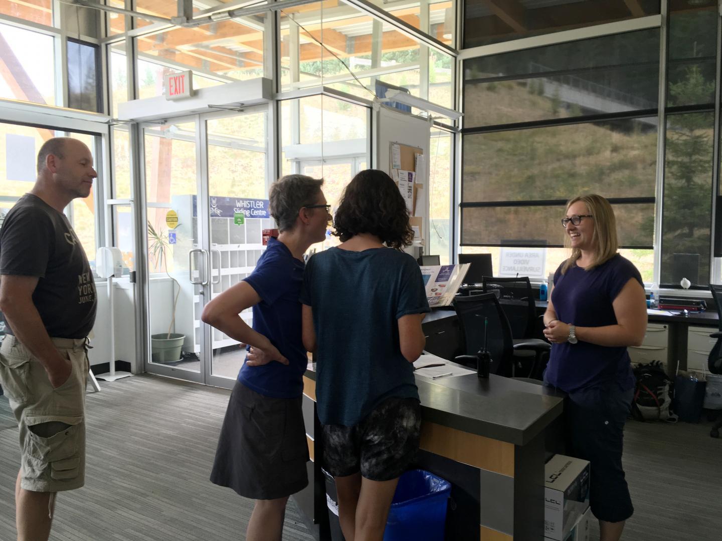 Guests checking in at customer service desk