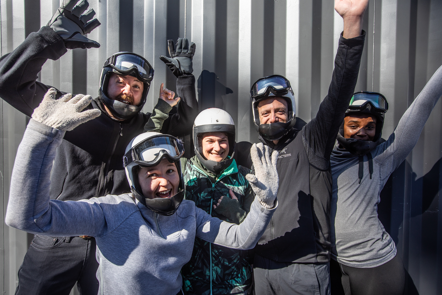 group of participants with hands up celebrating