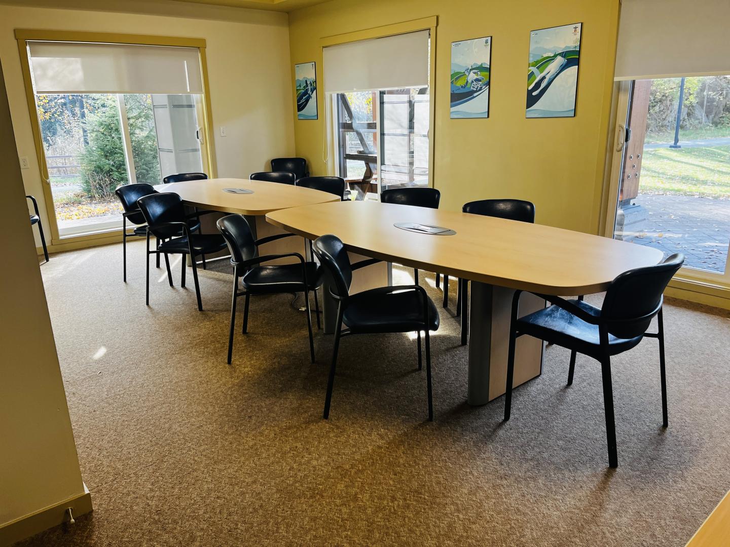 a boardroom with tables and chairs