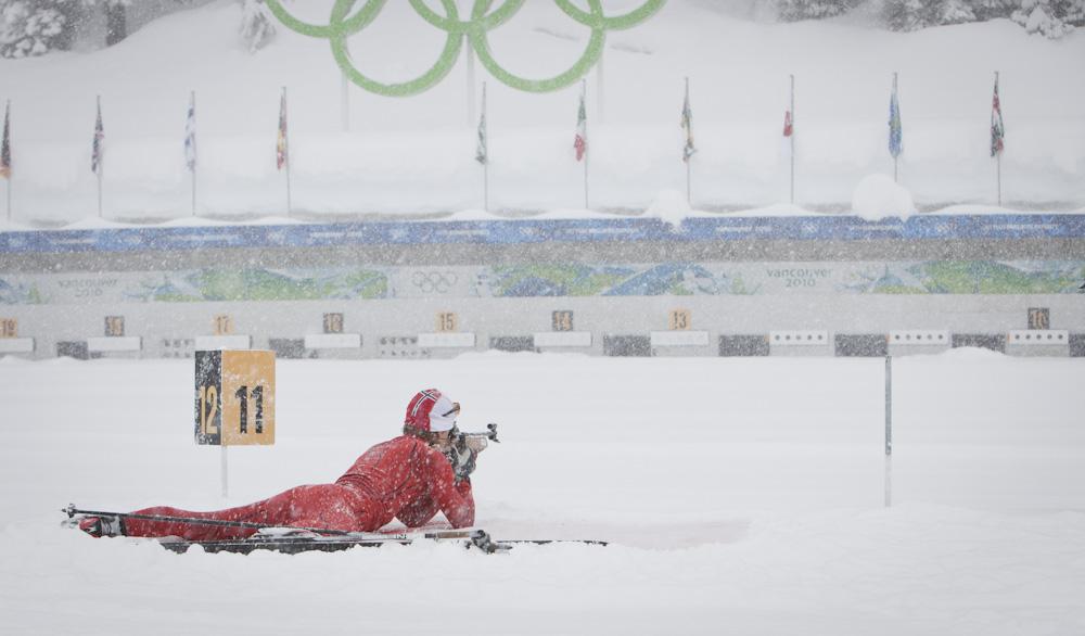 Biathlon gun range in winter with athlete