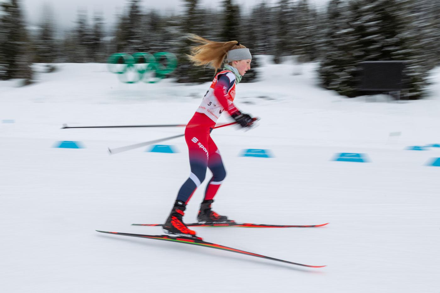 Cross Country Skiier passes Olympic Rings